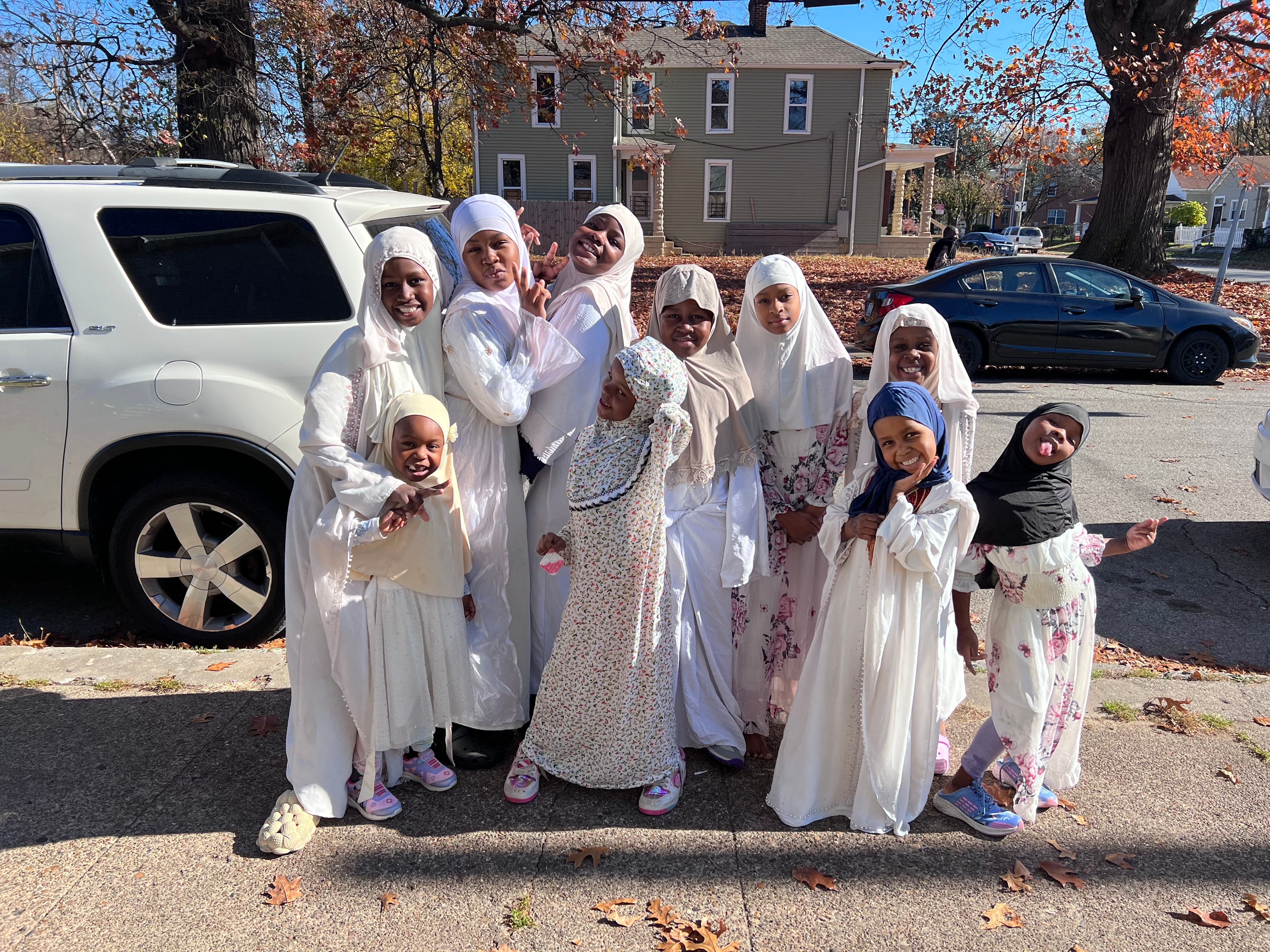 Diverse women laughing and celebrating together at a community gathering
