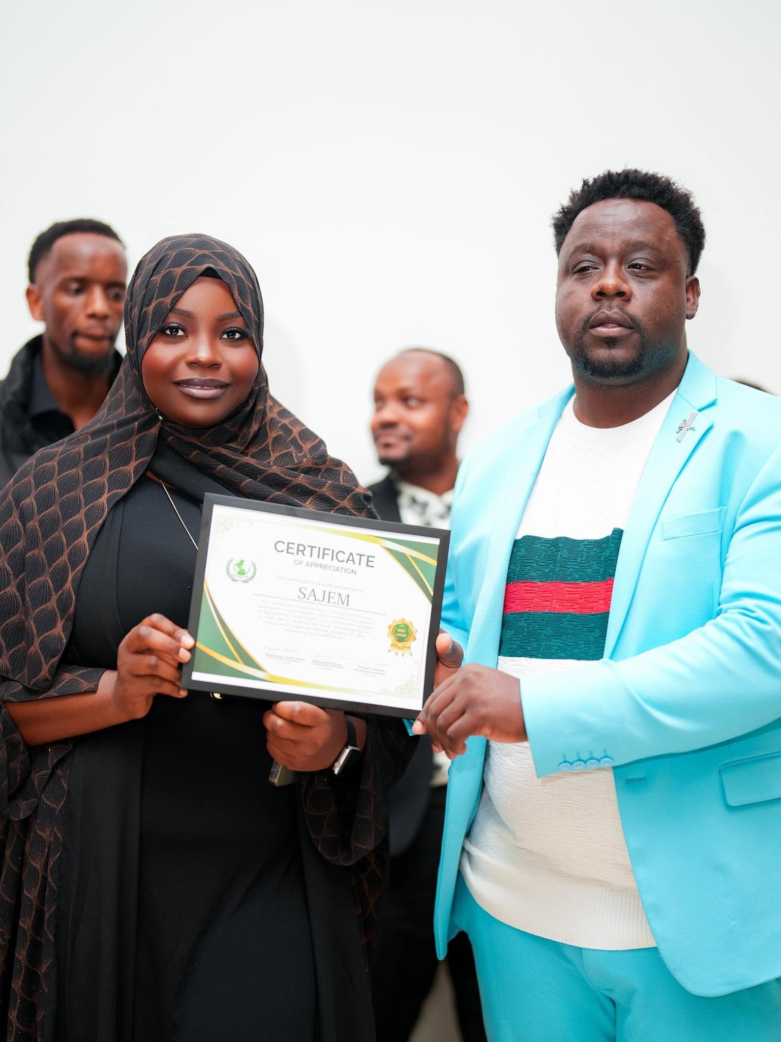 Woman receiving a certificate of appreciation