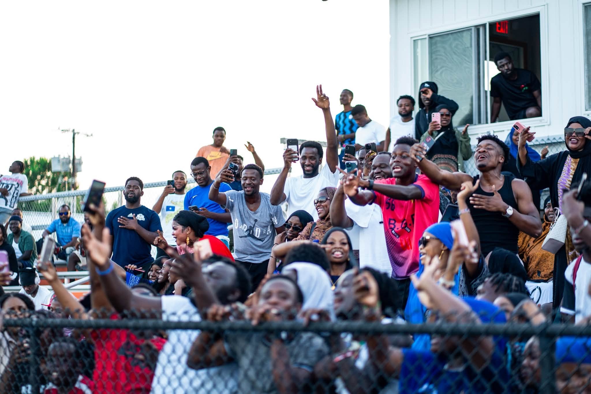 Large crowd celebrating at an outdoor event