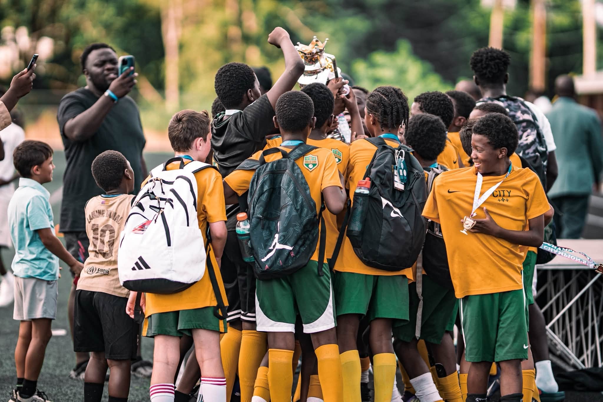 Youth soccer team celebrating a trophy victory