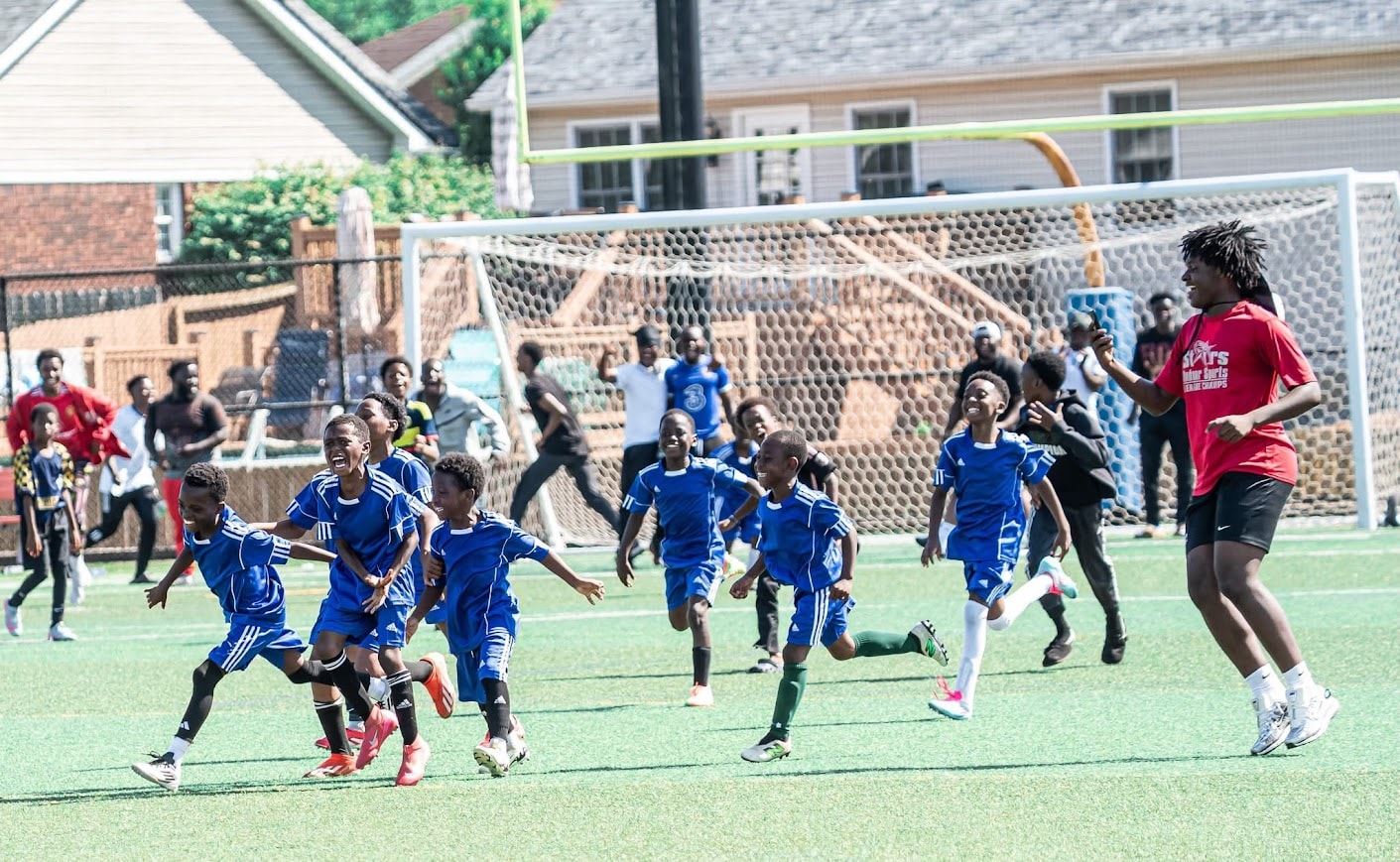 Children playing a soccer match outdoors