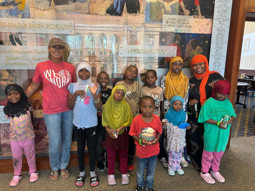 Woman and children posing together indoors